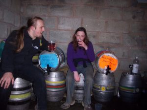 Dan & Claire drink beer in a lambing shed