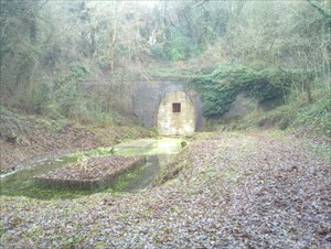 Bricked-up railway tunnel near a geocache.