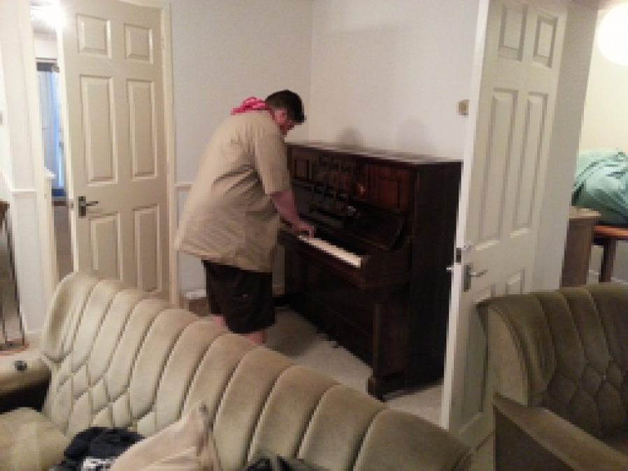 Alec tests the piano at Greendale.