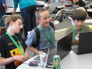Children programming on laptops. Photograph copyright Steven Luscher, used under Creative Commons license.