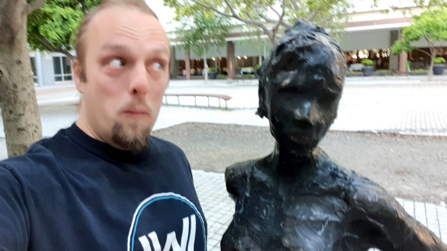Dan with a statue at the GZ