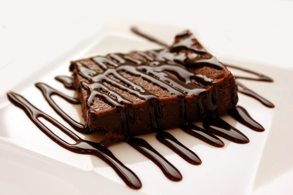 Chocolate brownie with melted chocolate sauce.