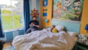 JTA and the kids relaxing in our Octonauts-themed hotel room.