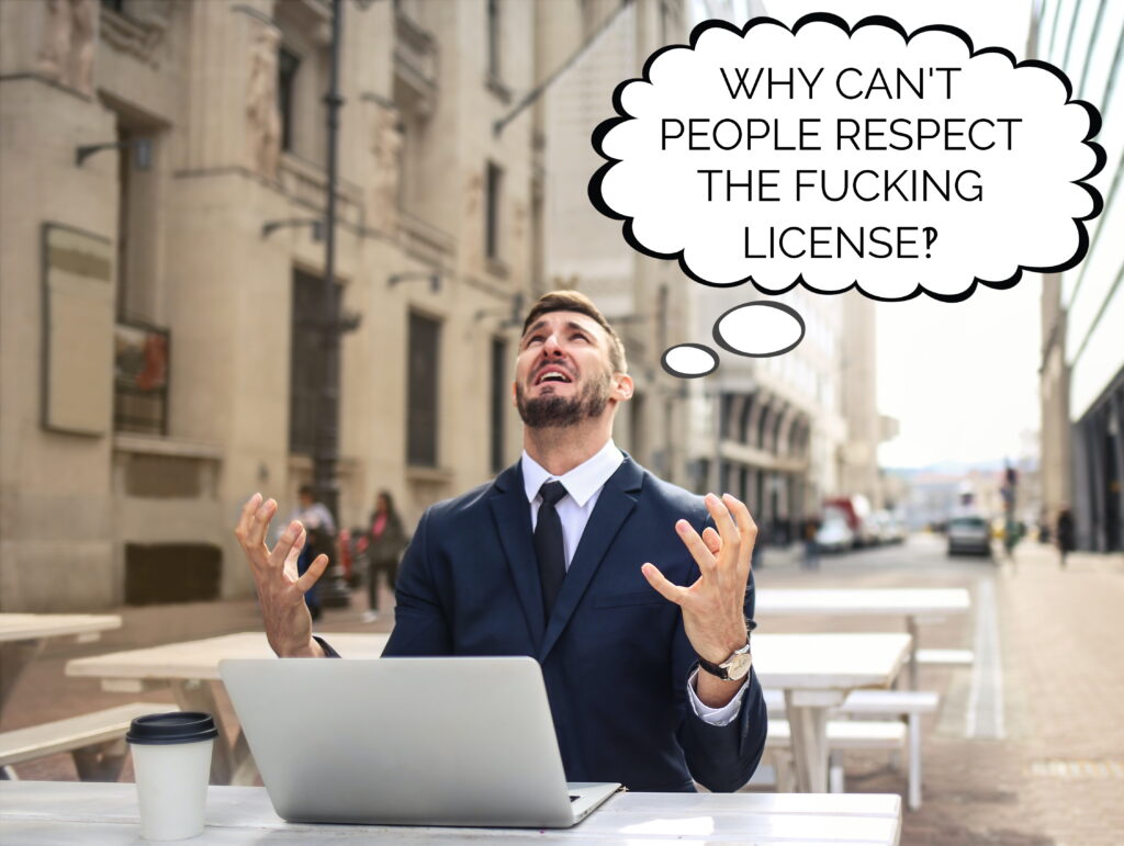 A man in a suit sits outdoors with a laptop and a cup of coffee. He is angry and frustrated, and a bubble shows that he is thinking:"why can't people respect the fucking license?!"