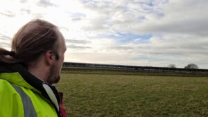Dan looks towards a solar farm