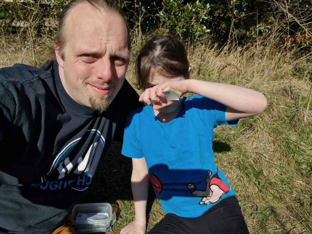 Dan and Annabel with a geocache.