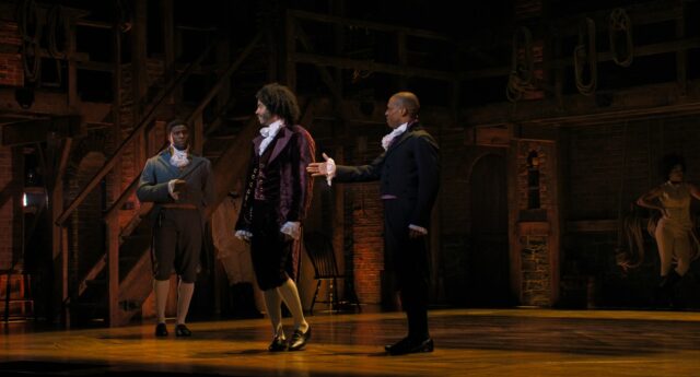 From the musical Hamilton, Burr offers his hand to Jefferson, who turns his back.